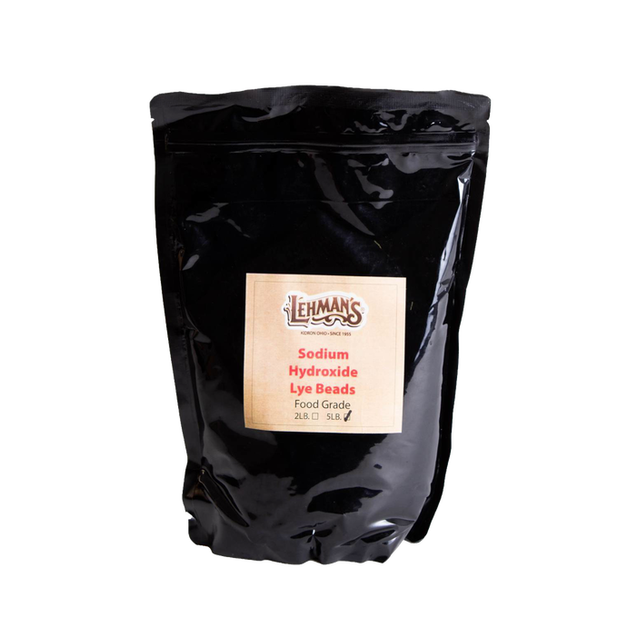 Resealable black pouch of food-grade sodium hydroxide lye beads with Lehman’s label, made in USA and featured in Health & Wellness, Soaps and Soapmaking, and Soapmaking Supplies collections.