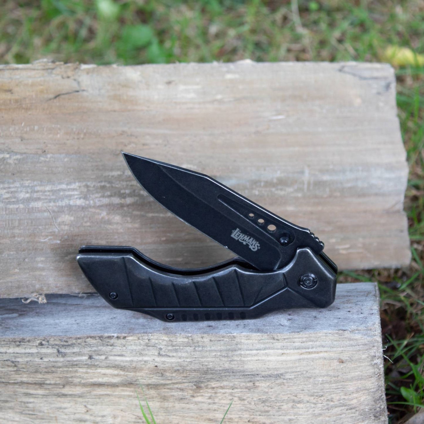 Blackened stainless steel lockback folding knife with ergonomic handle and thumb stud, part of Farm, Garden & Tool and Knives & Axes collections, ideal for everyday use.