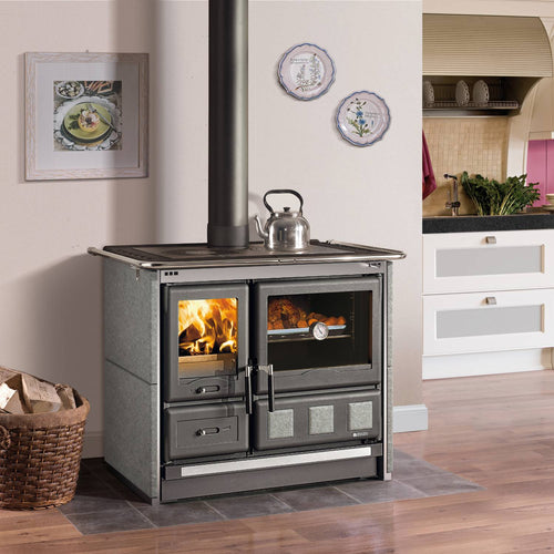 Wood-burning cook stove with porcelain enameled steel oven door, polished cast iron top cooking plates, and extractable ash drawer, set in a kitchen environment, perfect for Stoves and Cookstoves collections.