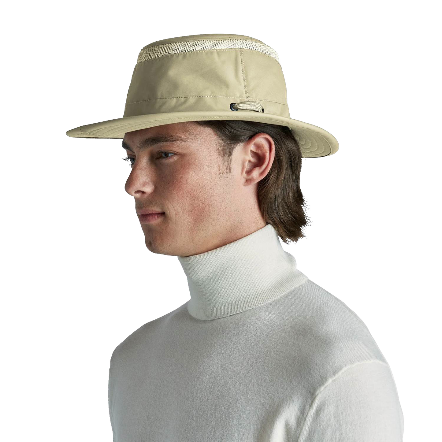 Man wearing a khaki breathable medium brim hat designed for sun protection and ventilation, styled with a white turtleneck, suitable for outdoor, health, and wellness activities.