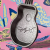 Small cast iron skillet shaped like a guitar with an embossed signature design, handcrafted in the USA, ideal for Kitchen & Food, Cast Iron, and Cookware collections.