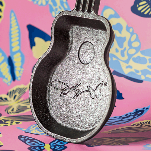 Small cast iron skillet shaped like a guitar with an embossed signature design, handcrafted in the USA, ideal for Kitchen & Food, Cast Iron, and Cookware collections.