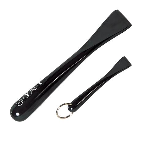 Set of two sleek, hard resin cleaning tools with smooth black finish, designed for faster cleanup on glass-top stoves, cookware, and hardwood floors, featured in household cleaning collections.
