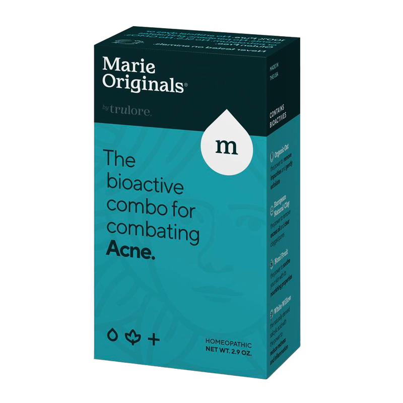 Box packaging for a homeopathic acne treatment product featuring a blue and black design, highlighting a bioactive formula included in Health & Wellness and Grooming collections.