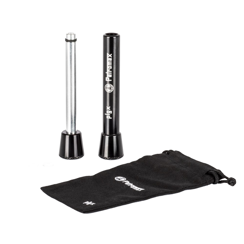 Camping firestarter tool with a cylindrical metal plunger and black outer casing, accompanied by small parts and a branded black drawstring pouch, ideal for farm, garden, and emergency use.