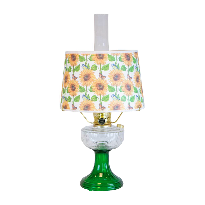 Handcrafted oil lamp with a clear chimney, featuring an Ohio-made emerald glass base and a bright sunflower-patterned shatterproof parchment shade, perfect for Farm, Garden & Tool, Lamps & Lighting, and Emergency Supplies collections.
