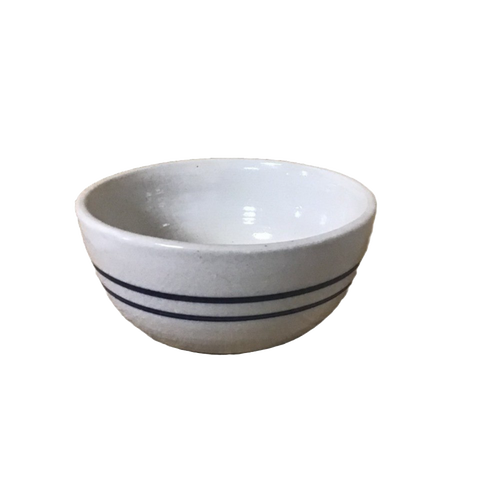 Hand-thrown stoneware bowl with double blue stripes on natural stone, handcrafted in the USA, ideal for serving salads or snacks in Kitchen & Food and Dinnerware collections.