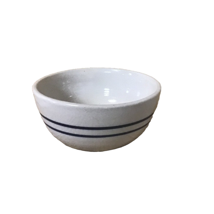 Hand-thrown stoneware bowl with double blue stripes on natural stone, handcrafted in the USA, ideal for serving salads or snacks in Kitchen & Food and Dinnerware collections.