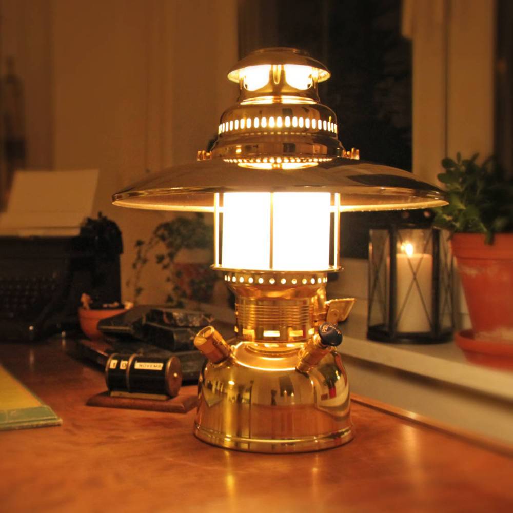 Vintage-inspired brass pressure lamp with a polished top reflector casting warm light indoors, perfect for Lamps & Lighting, Parts and Accessories, Other Parts, and Best Sellers collections.