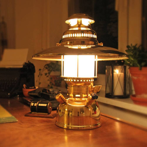 Vintage-inspired brass pressure lamp with a polished top reflector casting warm light indoors, perfect for Lamps & Lighting, Parts and Accessories, Other Parts, and Best Sellers collections.