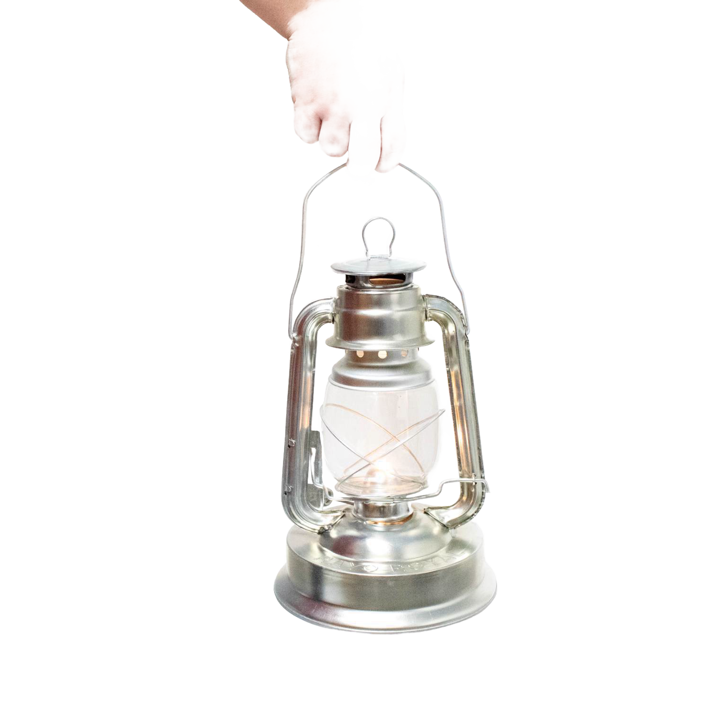 Hand holding a silver metal oil lantern with a clear glass globe and visible wick, designed for outdoor use in camping, pest control, and farm or garden lighting collections.