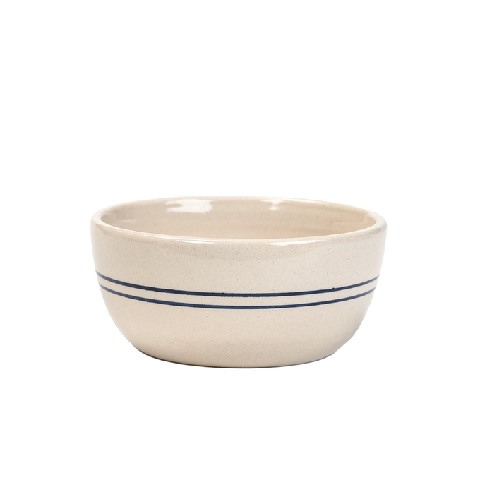 Handcrafted stoneware bowl with natural finish and double blue stripes, durable and made in the USA, perfect for kitchen, dinnerware, and holiday hosting collections.