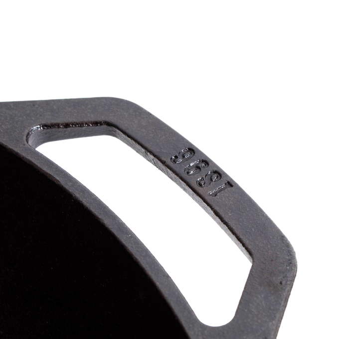 Close-up of a sturdy cast iron cookware handle featuring a vintage style and embossed year, showcasing durable construction ideal for Kitchen & Food and Cast Iron collections.