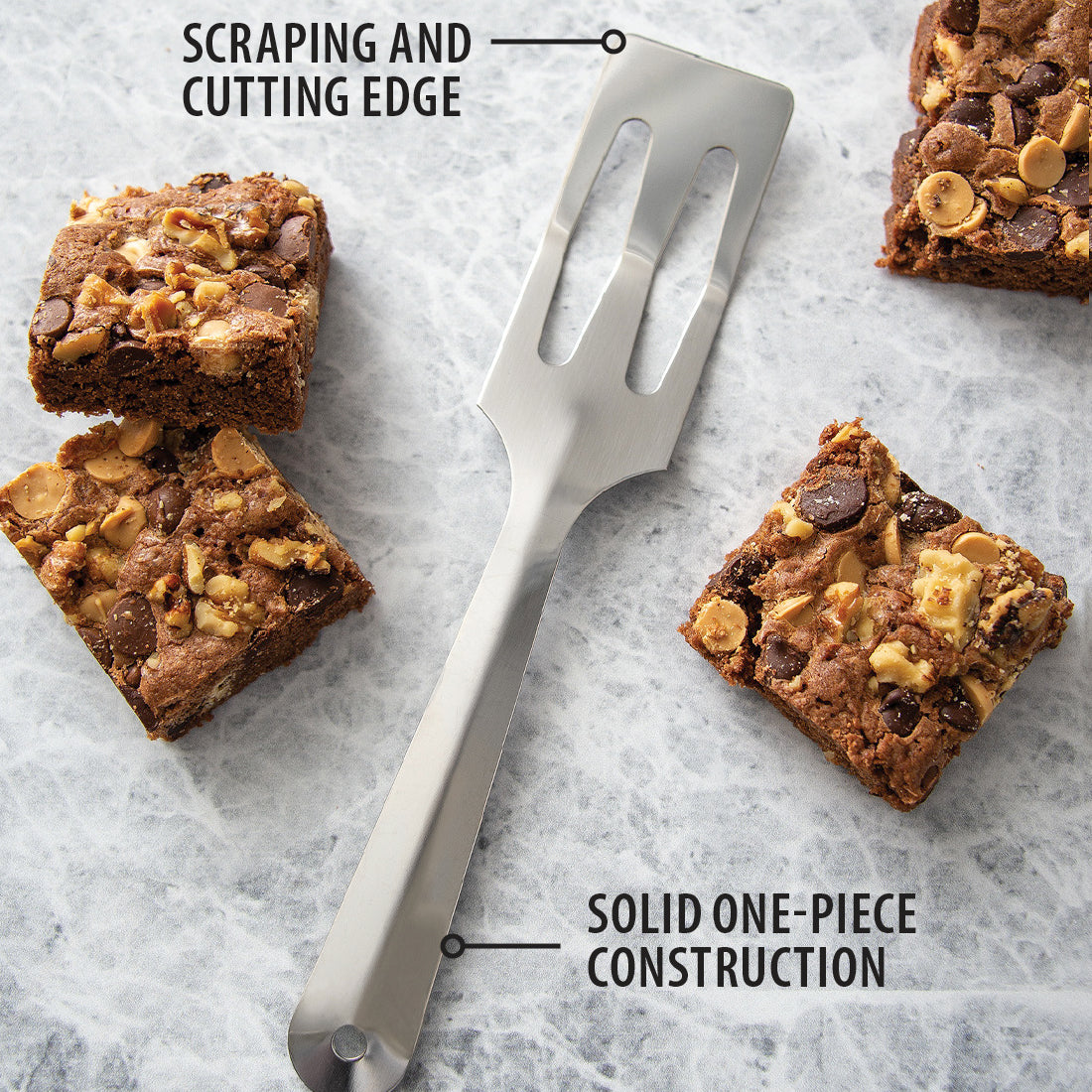 Stainless steel all-in-one kitchen tool spatula with angled slotted head for scraping and cutting, featuring solid one-piece construction, USA made, ideal for Kitchen & Food and Storage collections.