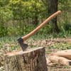 Hand-forged axe with a curved American hickory handle and single bit Swedish steel head embedded in a tree stump, ideal for Farm, Garden & Tool and Wood Cutting and Hauling collections.