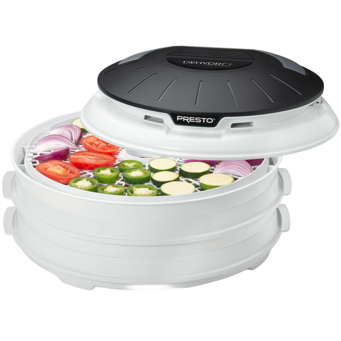Compact electric food dehydrator with nesting trays, shown with sliced tomatoes, zucchini, onions, and jalapeños inside, ideal for Kitchen & Food, Food Preservation, and Drying collections.