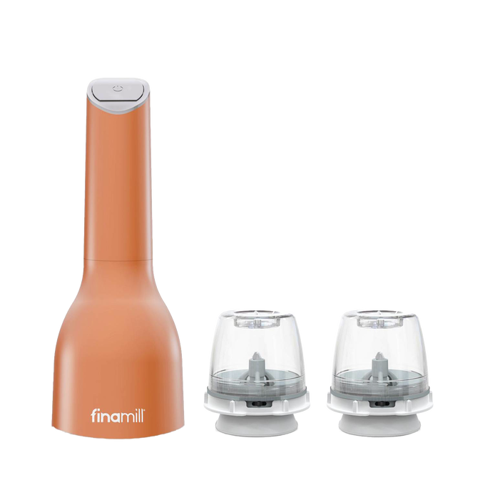 Battery-operated FinaMill grinder in rust-orange with two clear interchangeable grinding pods, designed for easy one-handed use, ideal for Kitchen & Food and Kitchen Gadgets collections.