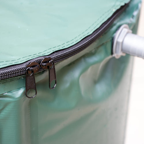 Close-up of a durable green collapsible rain barrel zipper and gray plastic spigot attachment, designed for easy assembly and water collection, featured in Farm, Garden & Tool and Lawncare collections.