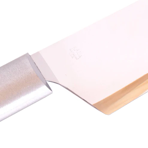 Close-up of a handcrafted stainless steel chef's knife with a smooth metal handle and sharp blade, demonstrating quality craftsmanship from USA made kitchen knives collections.