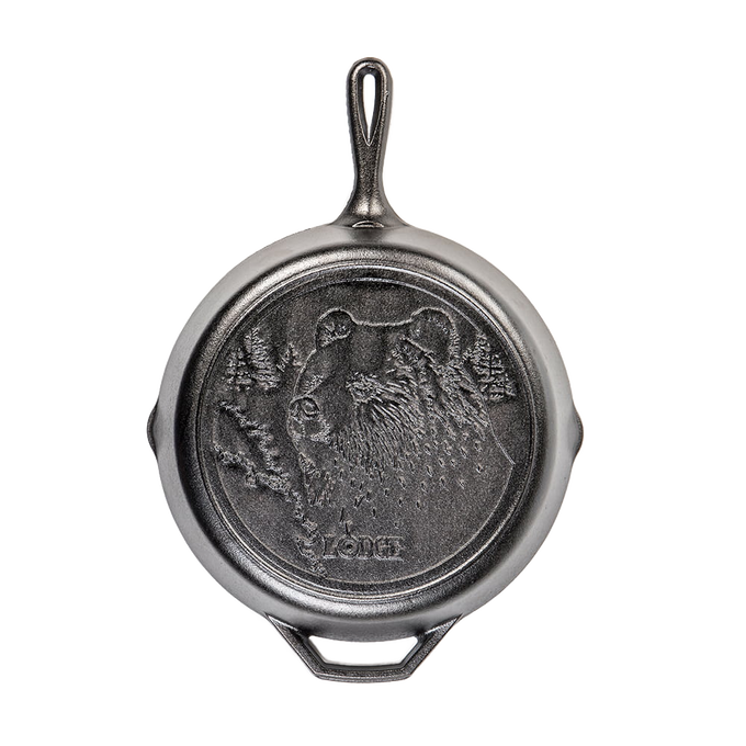 Cast iron skillet featuring a detailed bear design, crafted for durable use in kitchen and outdoor cooking, part of USA Made Cookware and Cast Iron collections.