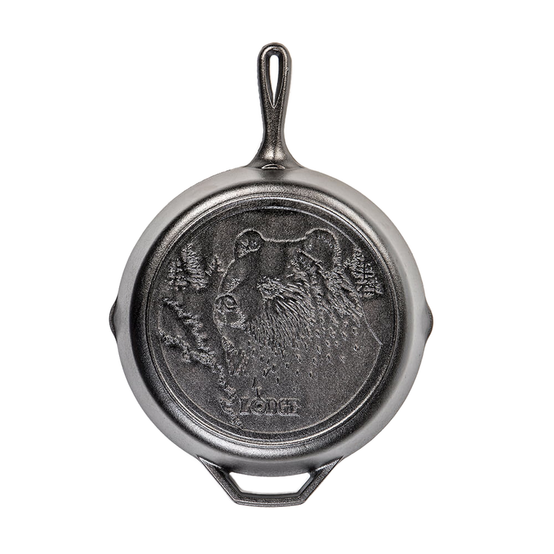 Cast iron skillet featuring a detailed bear design, crafted for durable use in kitchen and outdoor cooking, part of USA Made Cookware and Cast Iron collections.