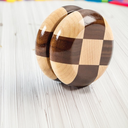 Handcrafted wooden yo-yo with alternating maple and walnut squares, smooth gleaming finish, Amish made in USA, perfect for indoor play, part of Toys, Books & Games and Wooden Toys collections.