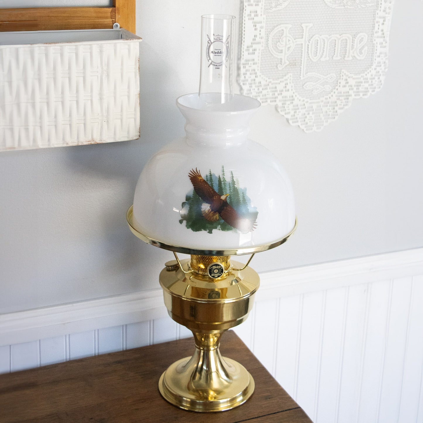 Handcrafted white glass lamp shade featuring a soaring eagle design over pine trees paired with a polished brass oil lamp base, ideal for Lamps & Lighting and Parts and Accessories collections.