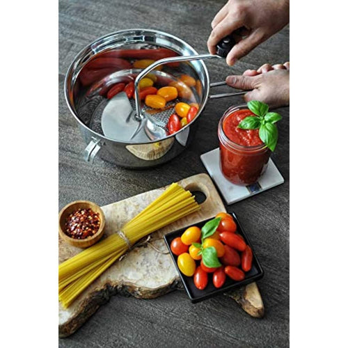 Hands turning a stainless steel food mill containing cherry tomatoes, beside a jar of fresh tomato sauce topped with basil, uncooked spaghetti, and a bowl of mixed cherry tomatoes with basil on a rustic wooden board, featured in Farm, Garden & Tool, Kitchen & Food, and Food Prep collections.