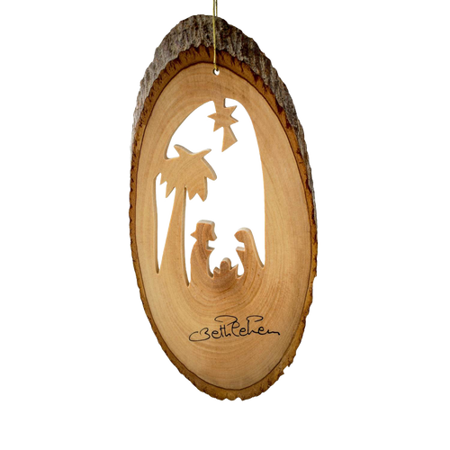 Handcrafted olive wood ornament featuring a nativity scene carved into a bark slice with palm tree detail, perfect for Home & Decor, Holiday Decor, and Best Sellers collections.