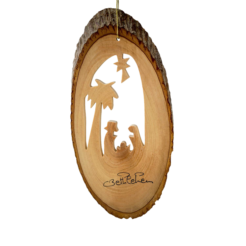 Handcrafted olive wood ornament featuring a nativity scene carved into a bark slice with palm tree detail, perfect for Home & Decor, Holiday Decor, and Best Sellers collections.
