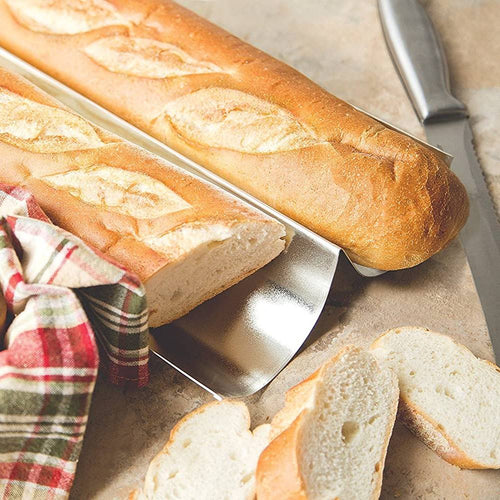 Two handcrafted heavy gauge tinplate steel pans holding freshly baked crusty French bread, accompanied by sliced bread and a knife, ideal for Kitchen & Food and Baking Supplies collections.