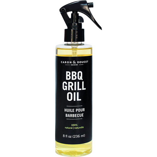 Clear spray bottle of natural BBQ grill oil with black label and trigger nozzle, designed for household cleaning and grilling use in home and decor collections.