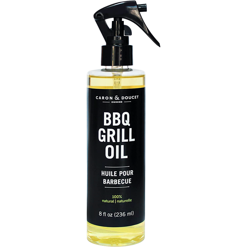 Clear spray bottle of natural BBQ grill oil with black label and trigger nozzle, designed for household cleaning and grilling use in home and decor collections.