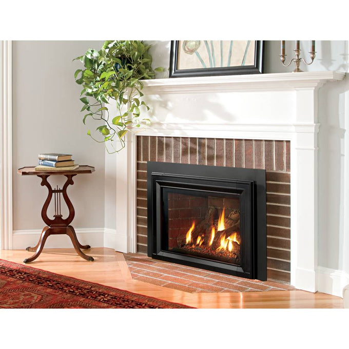Contemporary matte black gas insert framed by a white mantel and brick surround in a cozy living room, showcasing warmth and elegance for Stoves and Heatstoves collections.