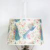Parchment oil lamp shade featuring a colorful peacock and floral pattern, designed to soften light, ideal for lamps and lighting, parts and accessories, and best sellers collections.