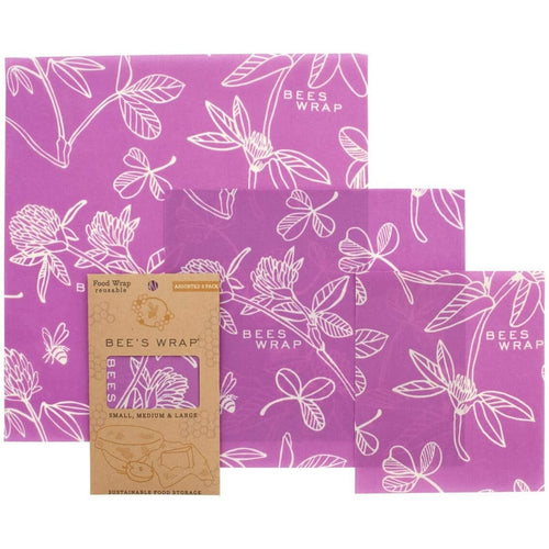 Set of three handcrafted beeswax wraps in vibrant purple with white botanical and bee illustrations, eco-friendly and reusable for kitchen food storage, part of Kitchen & Food, Storage and Serving, USA Made, Best Sellers, and Promo Eligible collections.
