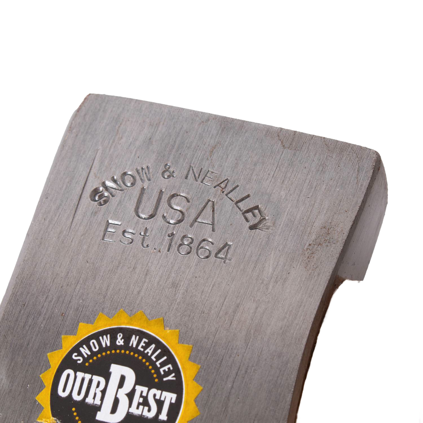 Close-up of a hand-tempered steel axe head stamped with "Snow & Nealley USA Est. 1864" and labeled with a circular yellow and black "Our Best" sticker, crafted for durability.