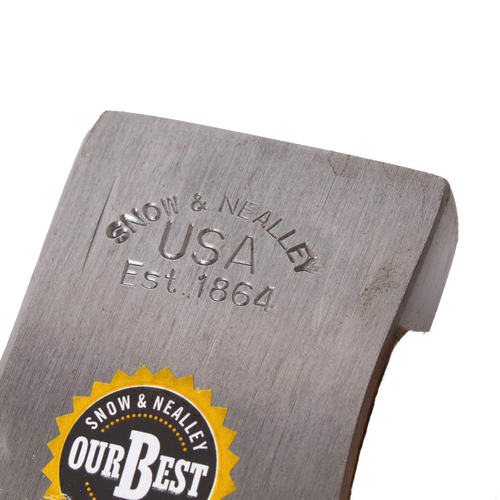 Close-up of a hand-tempered steel axe head stamped with "Snow & Nealley USA Est. 1864" and labeled with a circular yellow and black "Our Best" sticker, crafted for durability.