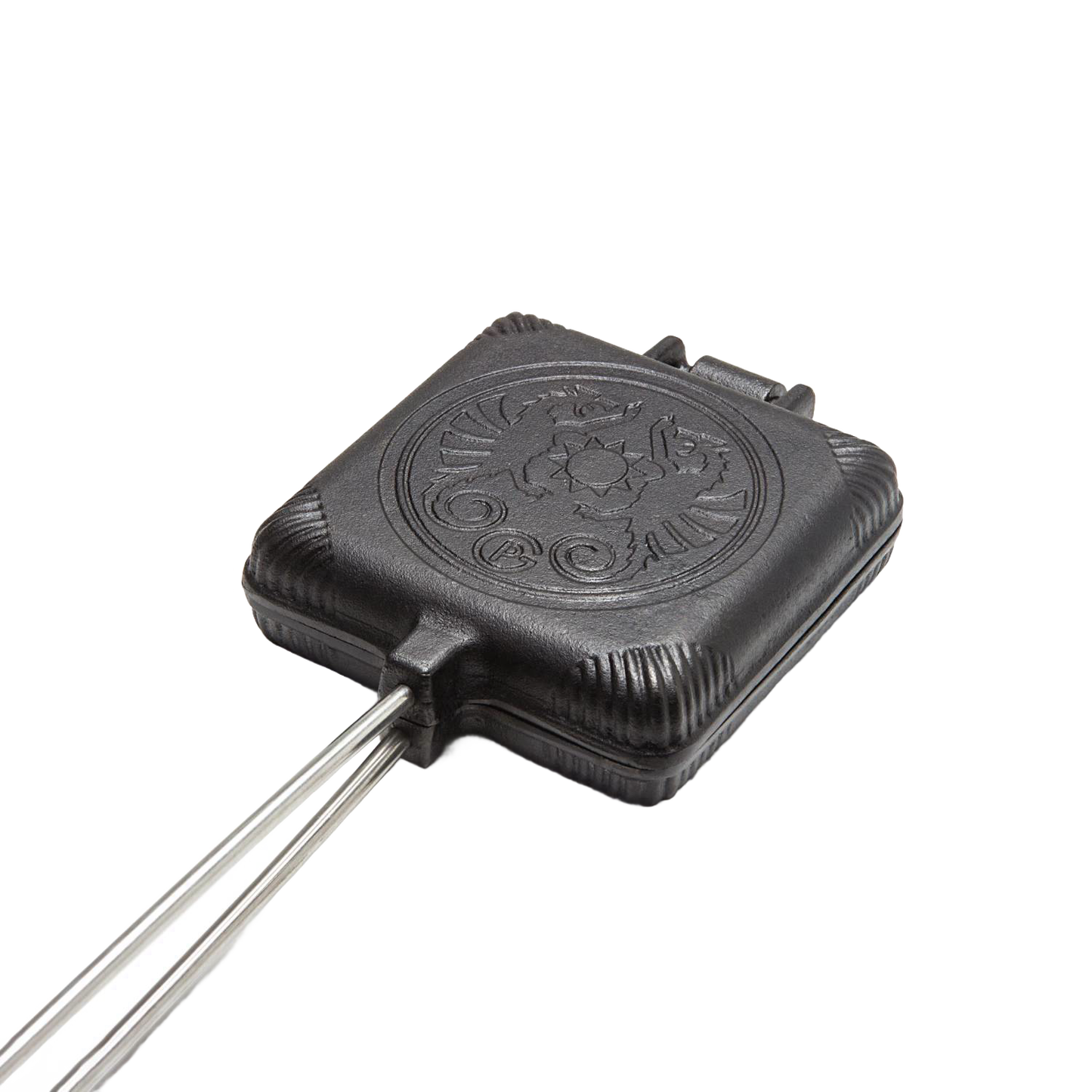 Cast iron sandwich iron with a hinged design and decorative embossed lid, suited for toasting sandwiches over campfires, featured in Farm, Garden & Tool and Camping collections.