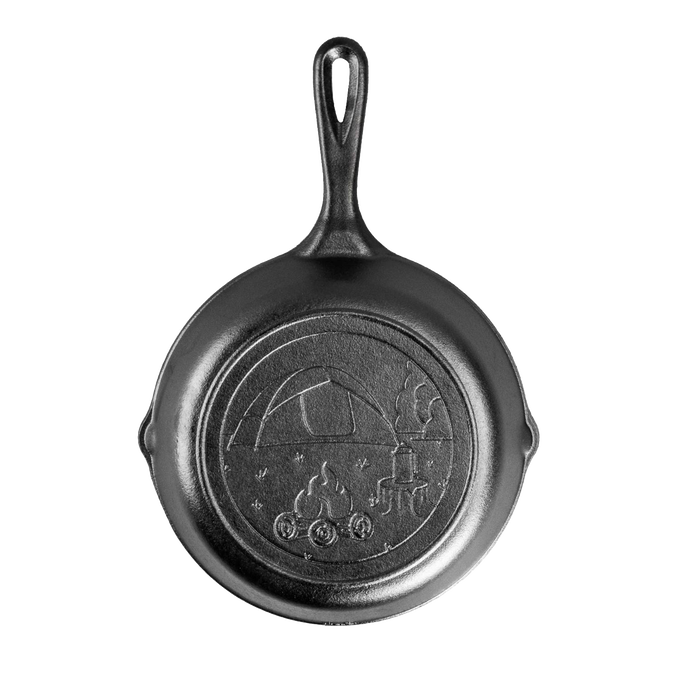 Handcrafted cast iron skillet featuring a tent and campfire design on the bottom, seasoned and made in USA, ideal for camping, cookware, and kitchen collections.