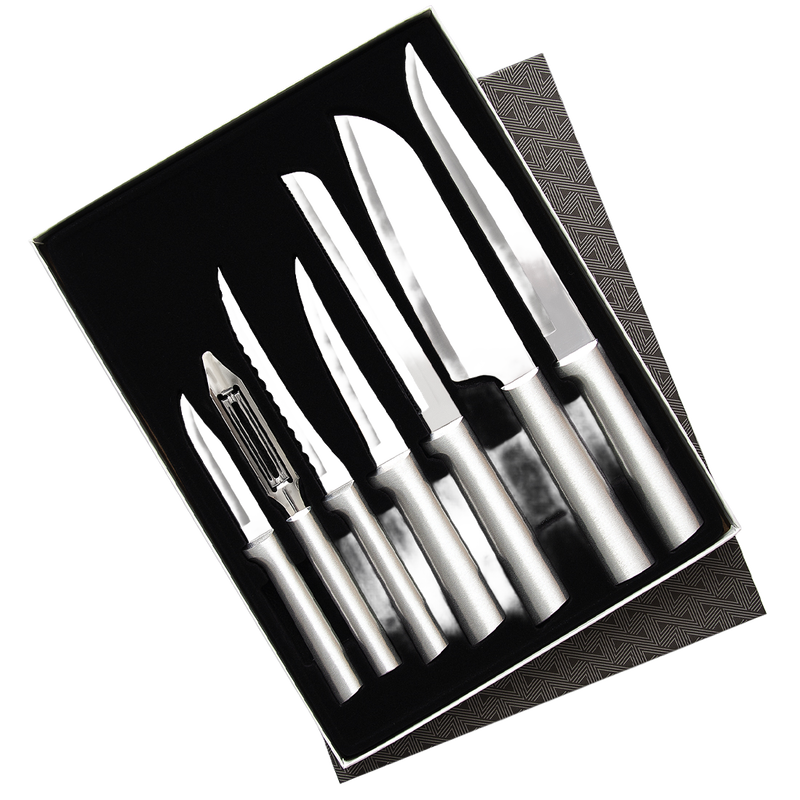 Set of seven handcrafted stainless steel knives and a vegetable peeler arranged neatly in a gift box, designed for food prep with sharp blades, made in USA, featured in Kitchen & Food and USA Made collections.