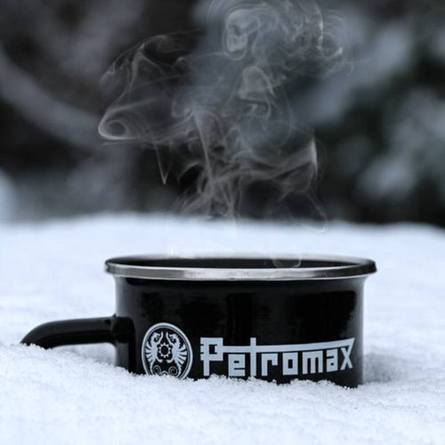 Black enamel steel mug with bold logo resting on fresh snow with steam rising, suited for Farm, Garden & Tool, Camping, Brewing Coffee and Tea, Kitchen & Food, Dinnerware, and Best Sellers collections.