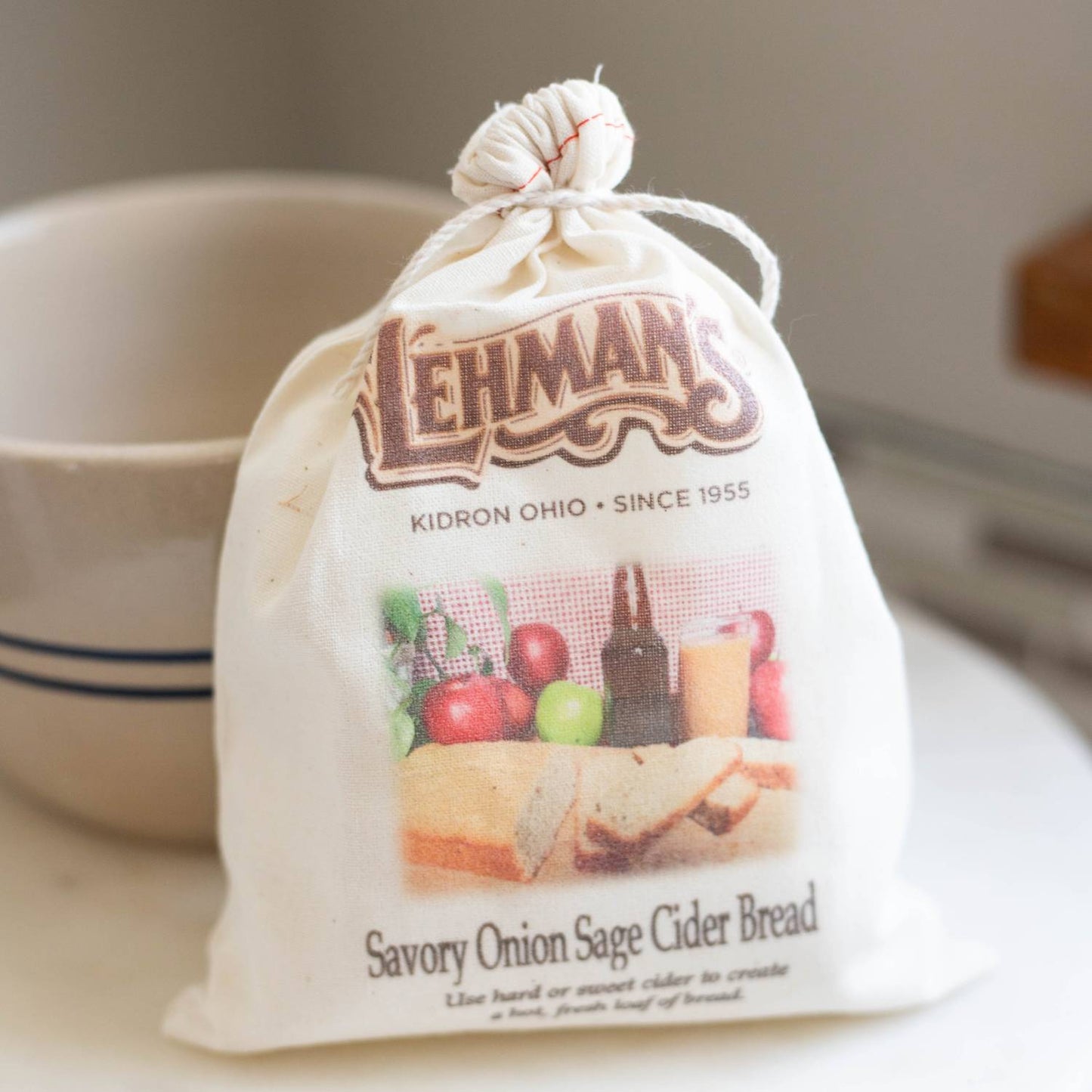 Natural cotton drawstring bag containing handcrafted savory onion sage cider bread mix, with rustic styling, ideal for Kitchen & Food, Pantry, Dry Goods and Mixes, Best Sellers, Promo Eligible collections.