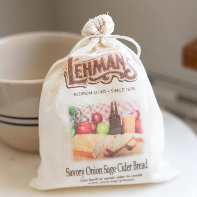 Natural cotton drawstring bag containing handcrafted savory onion sage cider bread mix, with rustic styling, ideal for Kitchen & Food, Pantry, Dry Goods and Mixes, Best Sellers, Promo Eligible collections.