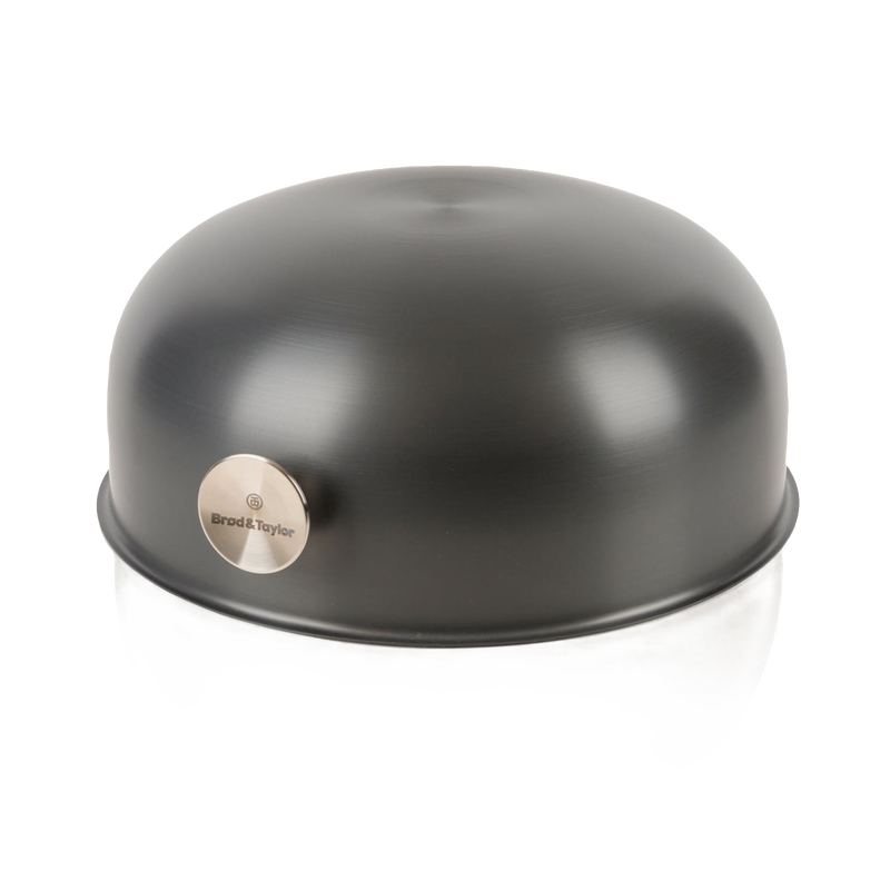 Matte black Brod & Taylor bread baking shell with smooth rounded dome shape and brushed metal logo badge, designed for Kitchen & Food, Cookware, and Baking Supplies collections.