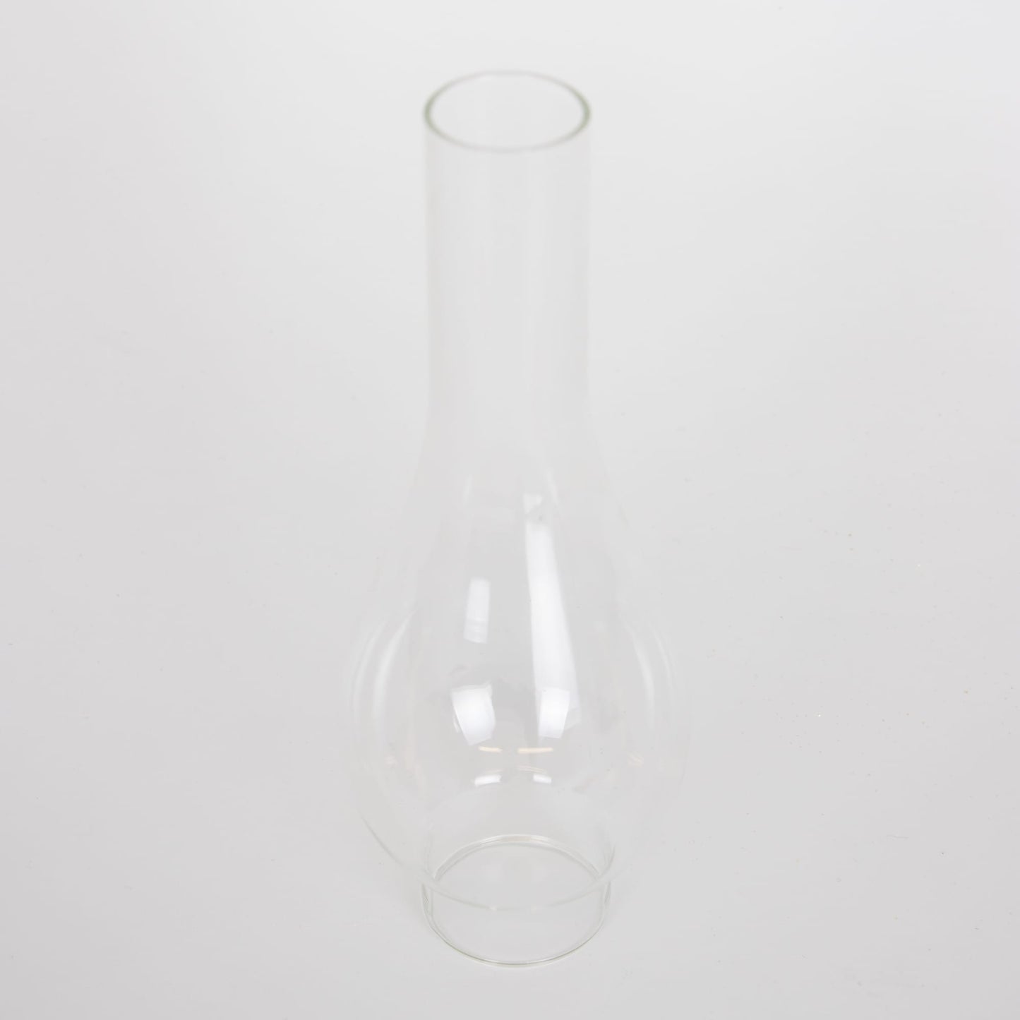 Handcrafted clear glass oil lamp chimney with a 2-inch base and tall rounded shape, designed for use with various lamps, featured in Lamps & Lighting, Parts and Accessories, Chimneys and Globes, Best Sellers, and Promo Eligible collections.