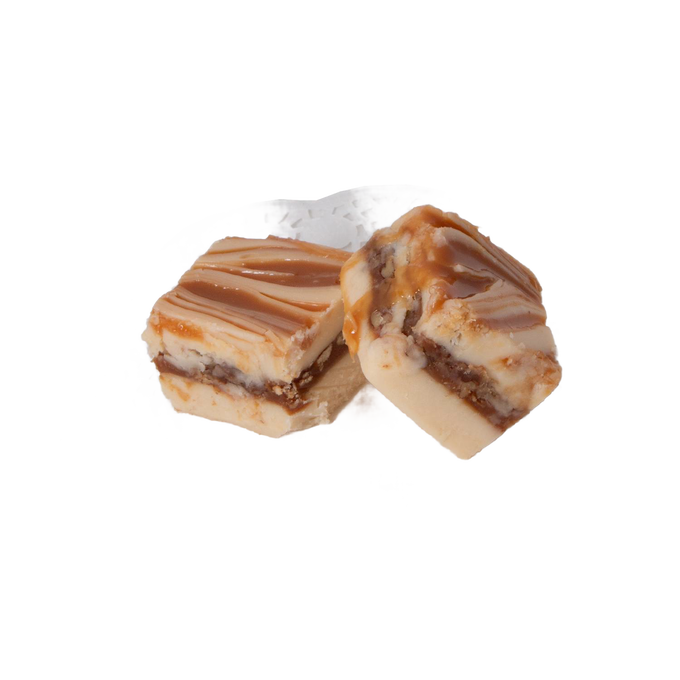 Two handcrafted creamy and caramel swirled fudge pieces with a layered texture, showcased on a decorative white doily, part of Kitchen & Food, Snacks and Sweets, USA Made, and Best Sellers collections.