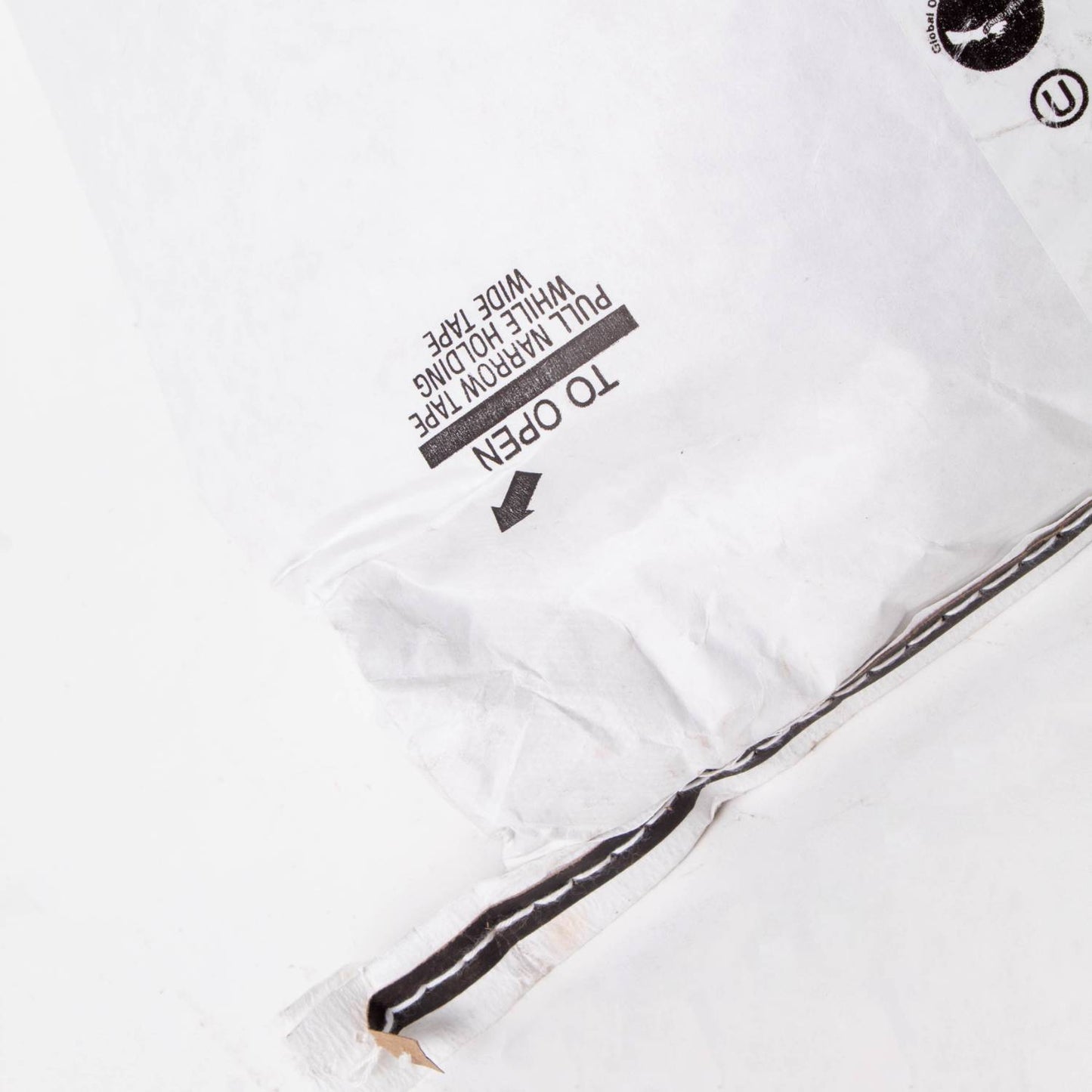 Close-up of the sealed white paper bag with printed instructions and pull tape, designed for packaging 25 lb of organic whole kernel yellow corn, featured in Farm, Garden & Tool and Pantry collections.