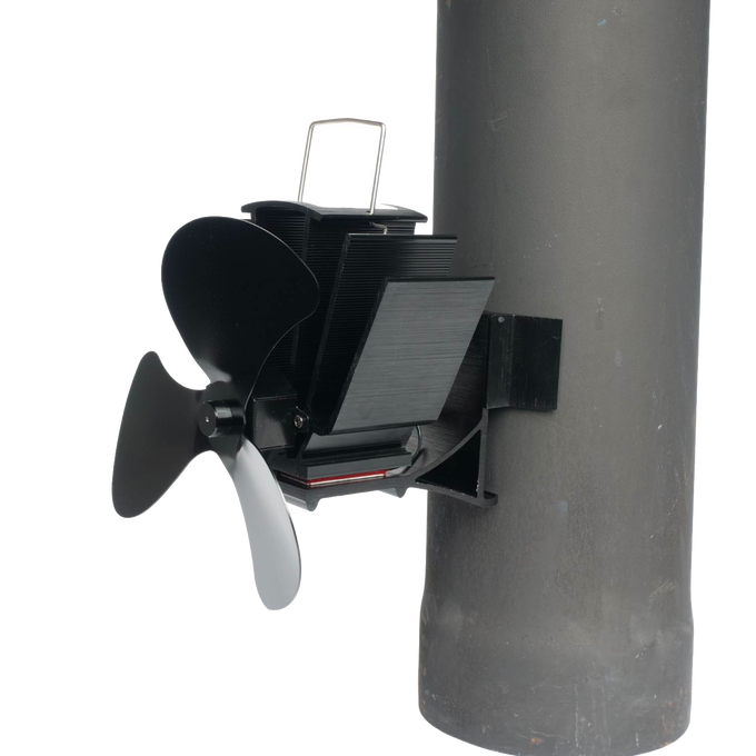 Black three-bladed heat-powered magnetic fan attached to a stove flue pipe with metal fins, designed to circulate warm air, featured in Stoves, Hearth Accessories, Best Sellers, and Promo Eligible collections.