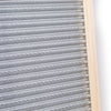 Handcrafted galvanized metal washboard with spiral crimp design and light wooden frame, designed for effective stain removal in laundry supplies, made in USA.